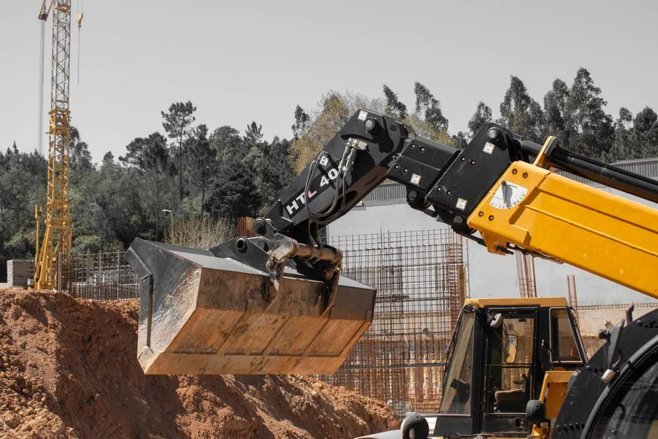 A vibrant construction site with heavy machinery and cranes in operation, showcasing industrial progress.
